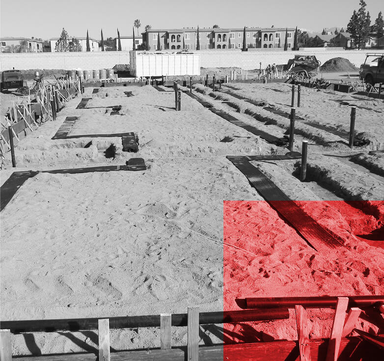 construction site at foundation level in black and white